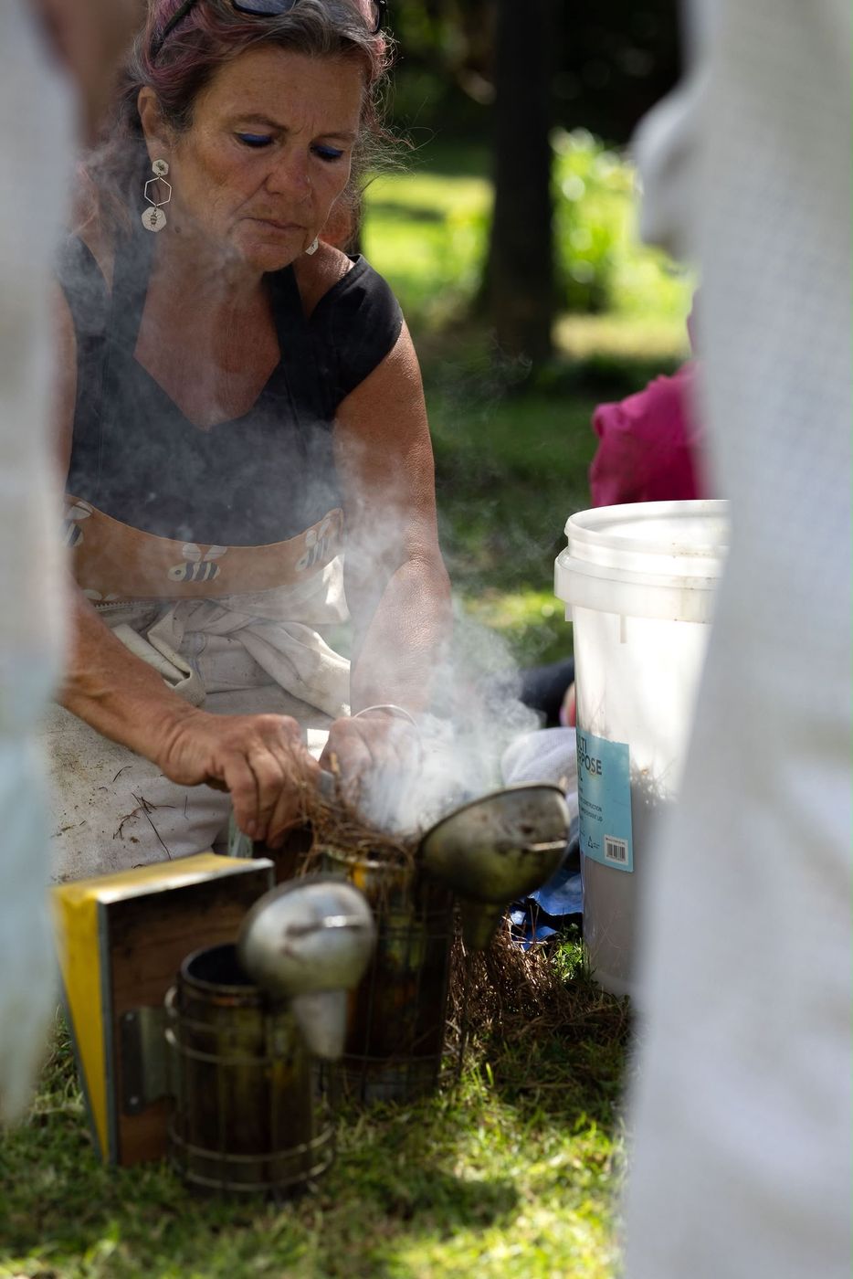 Preparing bee smokers before a hive visit